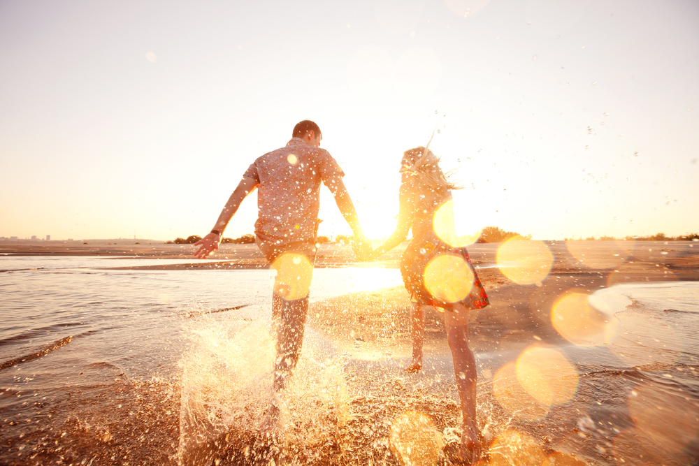 couple playing on the beach