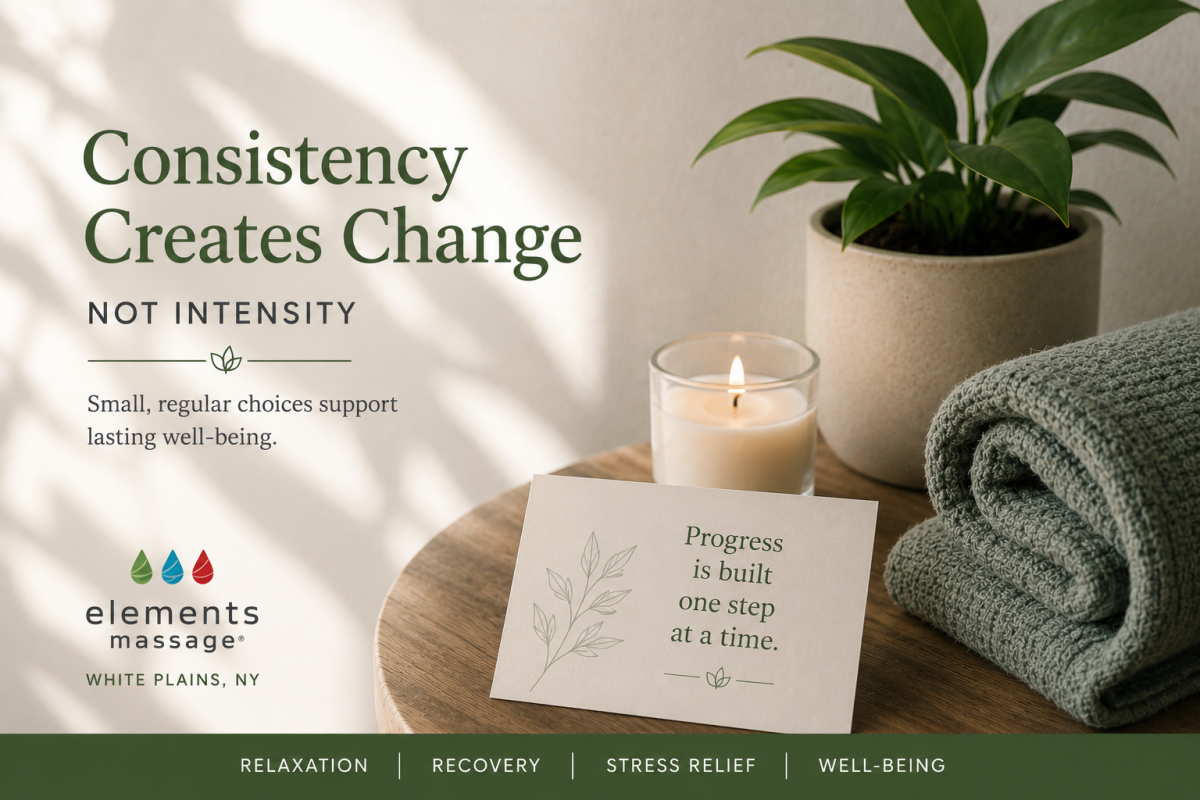 Elements Massage White Plains wellness image featuring a candle, folded towel, plant, and inspirational card. The image accompanies an article about why consistency often matters more than intensity, highlighting how small, regular wellness habits can sup