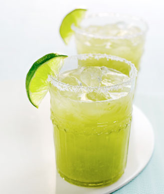 margaritas in glasses with lime wedge
